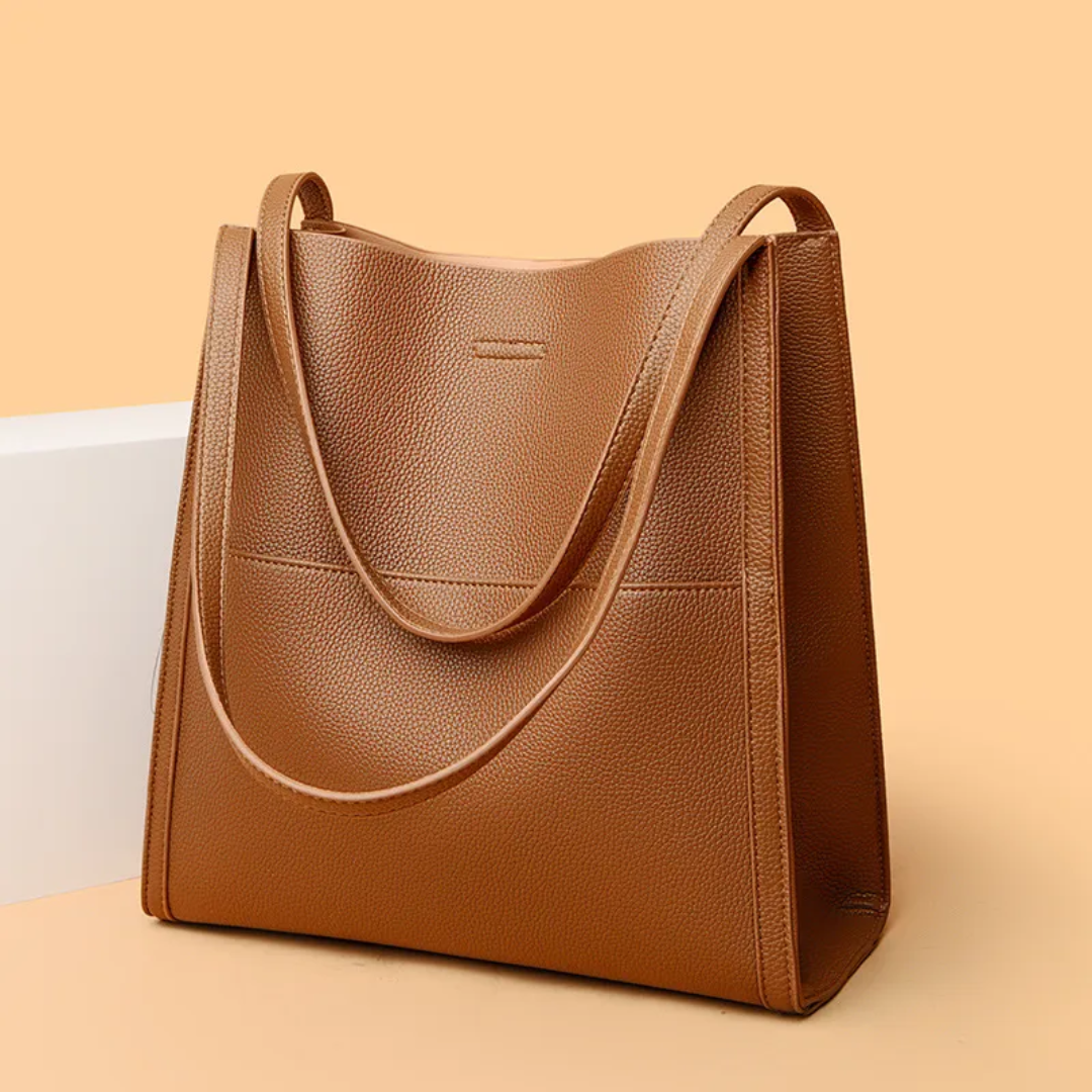 Black women's large capacity leather shoulder bag. Durable and stylish handbag for daily essentials and everyday use.