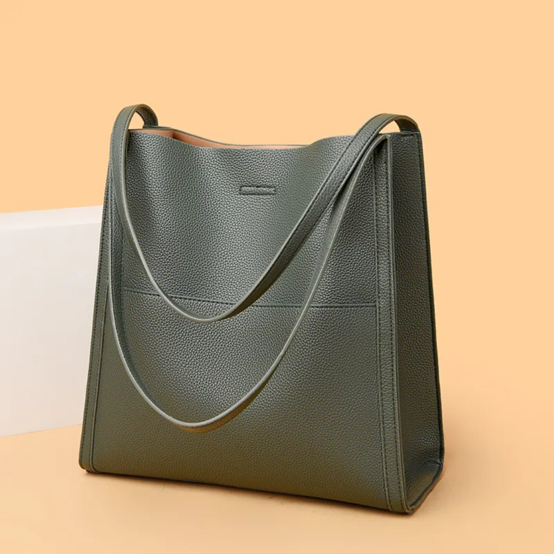 Premium quality brown leather women's handbag. Spacious, durable, and stylish shoulder bag for daily essentials.
