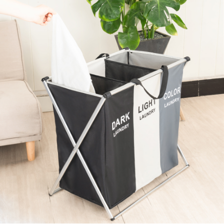 Portable fabric 3-compartment laundry sorter hamper with an aluminum frame, ideal for clothes organization.