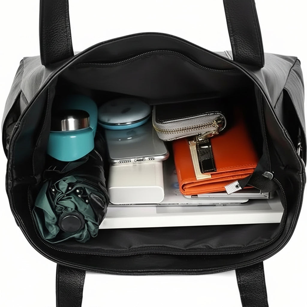 Modern black women's shoulder bag, a spacious everyday tote. Perfect versatile handbag for daily essentials.