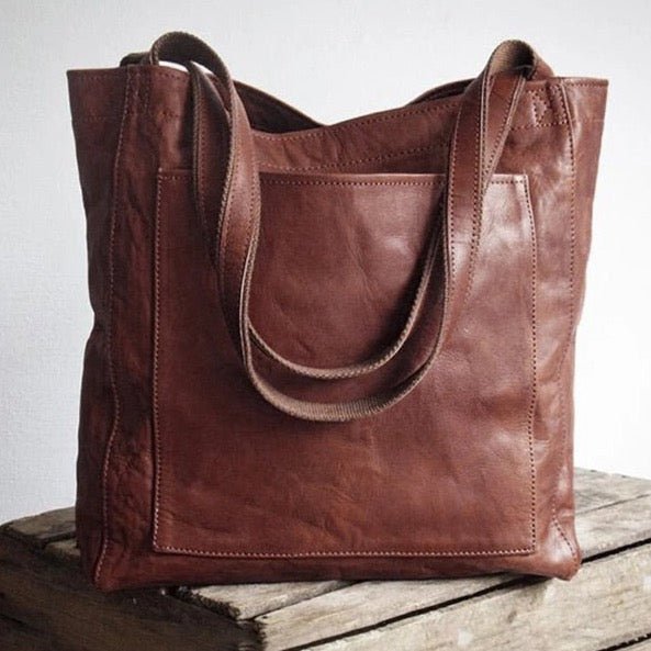 Woman carrying a chic leather everyday handbag as a shoulder bag, complementing a modern outfit.