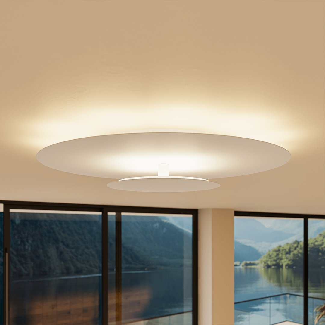 White modern LED flush mount ceiling light providing bright, ambient room illumination.