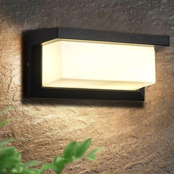 Modern LED outdoor wall light with motion sensor for energy-efficient exterior security.