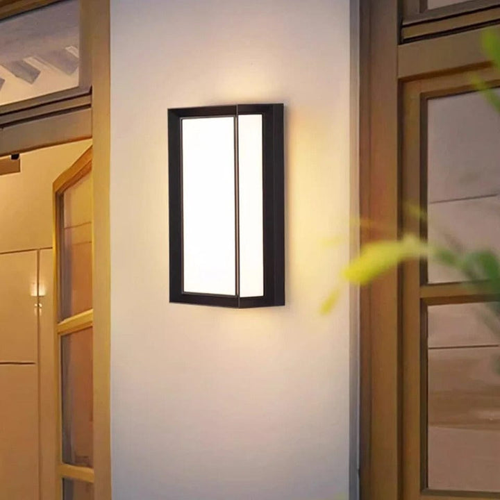 Contemporary LED outdoor wall sconce with integrated motion sensor, ideal for security lighting.