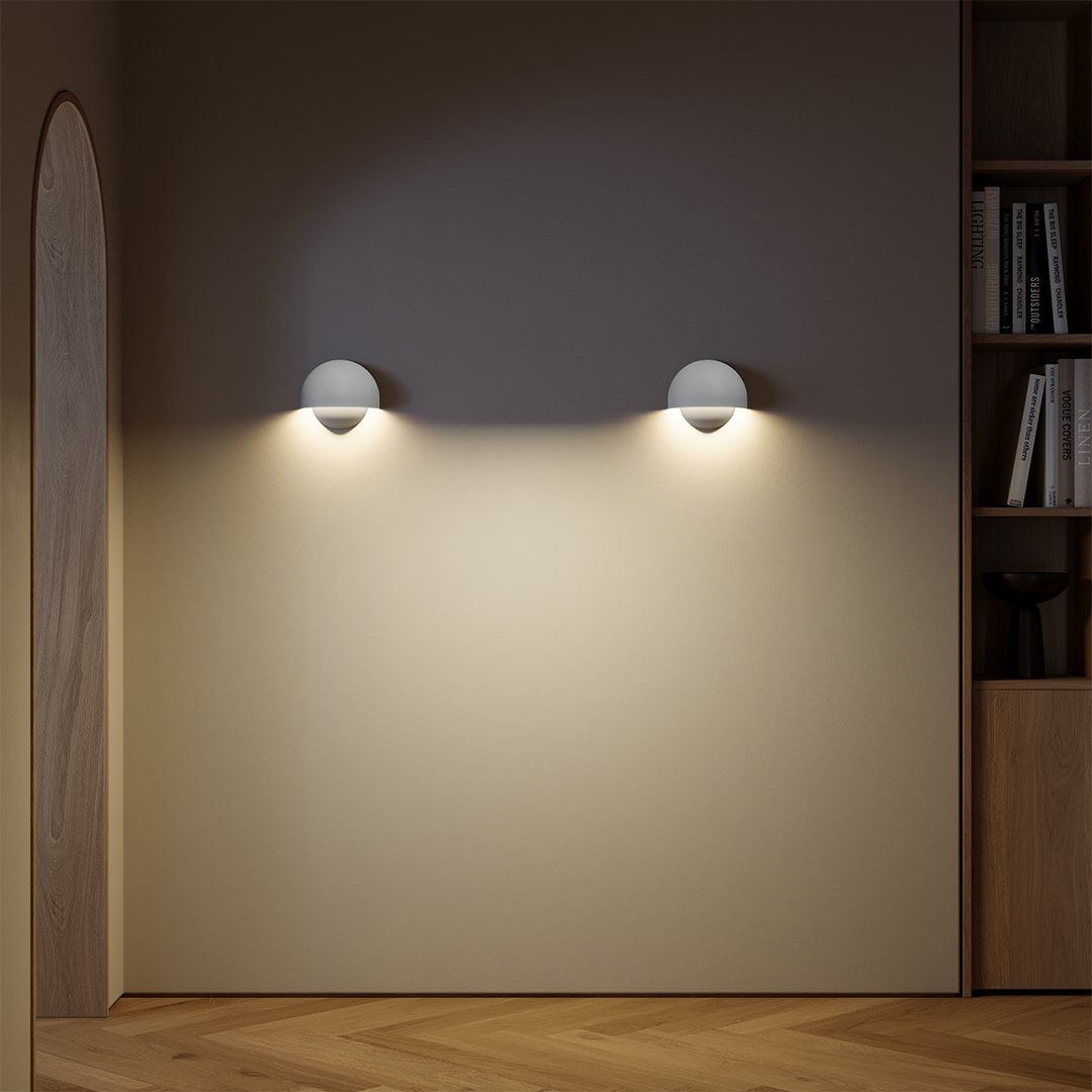 Wireless LED wall lamp, easy to install, emitting a warm white glow, ideal for contemporary home lighting.
