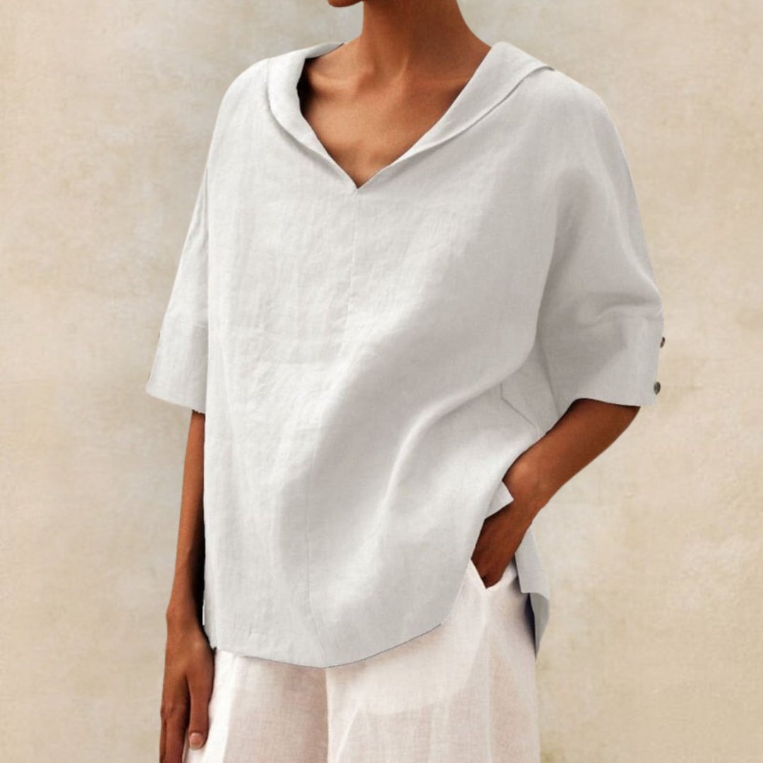 Close-up of a women's V-neck casual summer blouse, showing the elegant neckline and soft fabric texture.