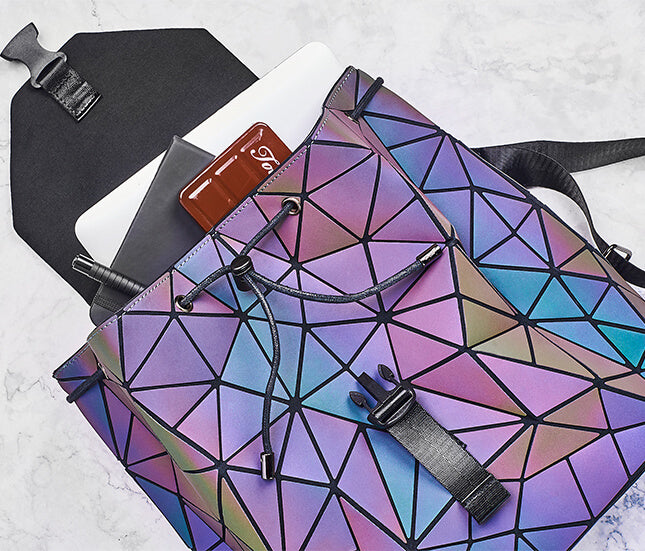 Unique water-resistant women's daypack with a reflective geometric and color-changing design.