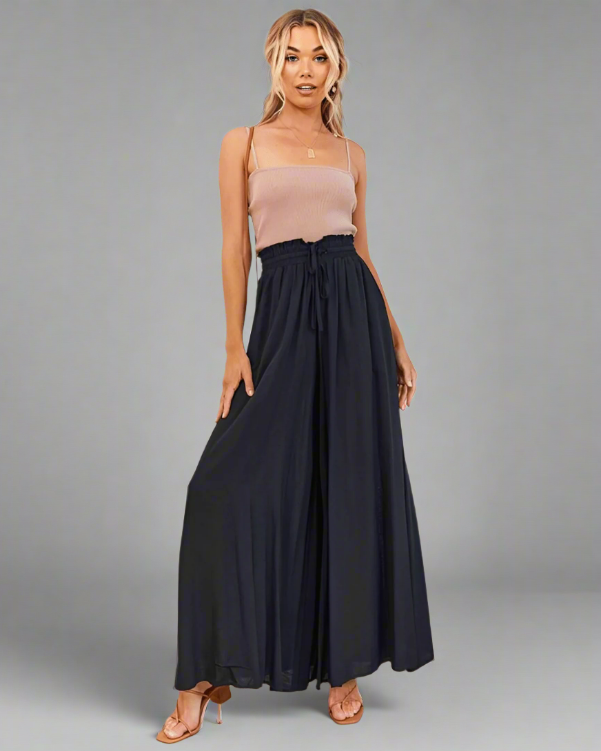 Comfortable women's high waist drawstring summer pants, loose fit ideal for beach, travel, and casual fashion.