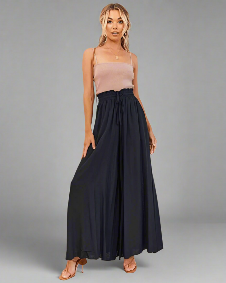 Comfortable women's high waist drawstring summer pants, loose fit ideal for beach, travel, and casual fashion.
