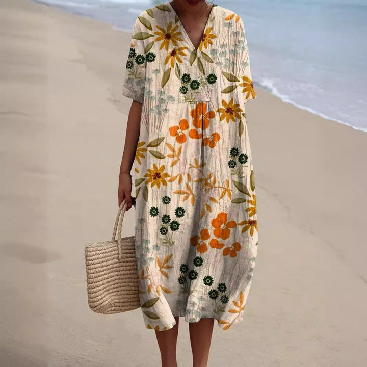 Lightweight & comfortable women's V-neck floral summer dress, perfect for sunny days.