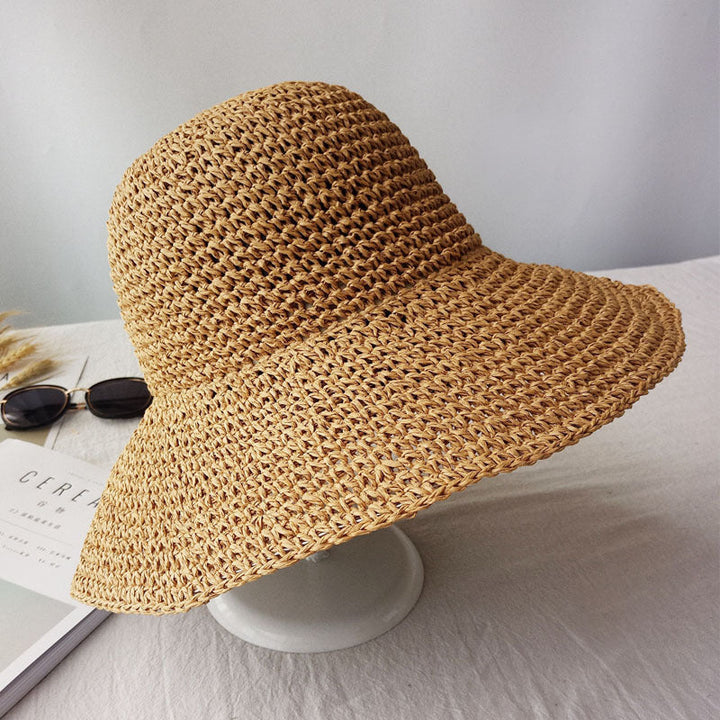 Lightweight women's retro flat brim hat, perfect for spring fashion, beach days, and sun protection.