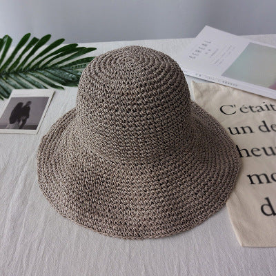Fashionable women's retro summer hat with a flat brim, offering elegant sun protection for leisure wear.