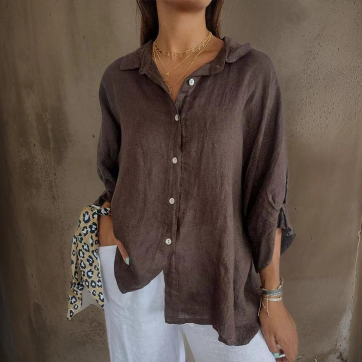 Women's sophisticated relaxed fit linen shirt with rolled cuffs, perfect for casual everyday wear.