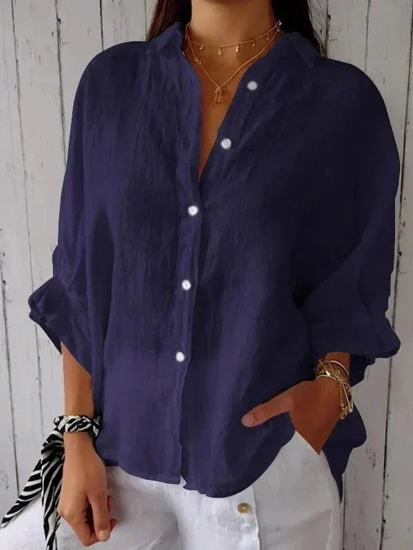 Brown women's long-sleeve oversized linen shirt, featuring a relaxed fit and stylish rolled cuffs for comfort.