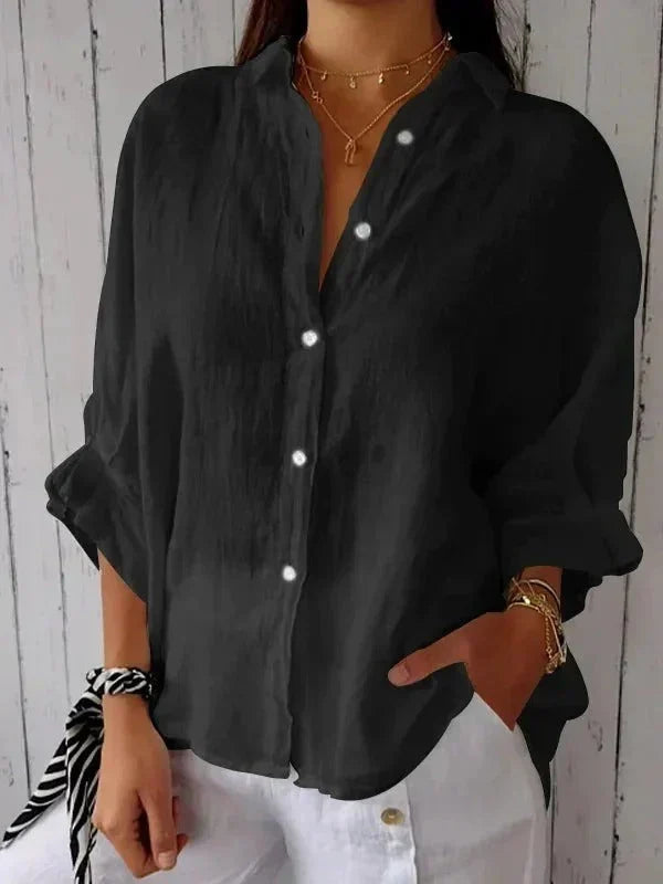 Black women's sophisticated linen shirt, button-down style with rolled cuffs, versatile for casual or elegant looks.