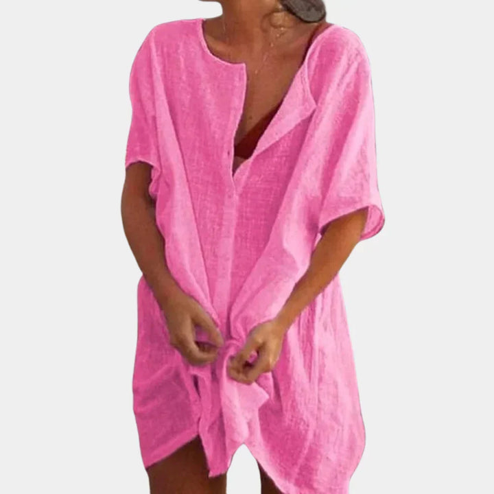 Loose fit women's short sleeve beach tunic cover-up. Versatile linen blend summer dress for casual resort and vacation days.