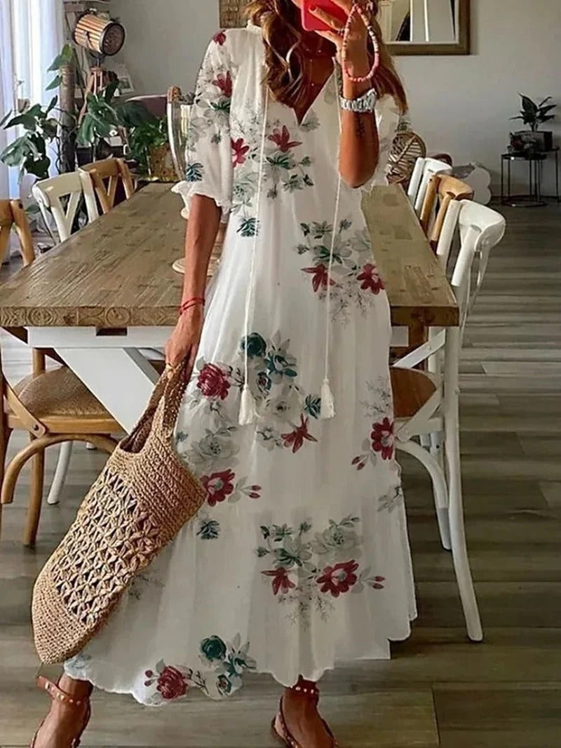 Beautiful flowy women's maxi dress with an eye-catching leaf pattern, ideal for warm weather and elegant wear.