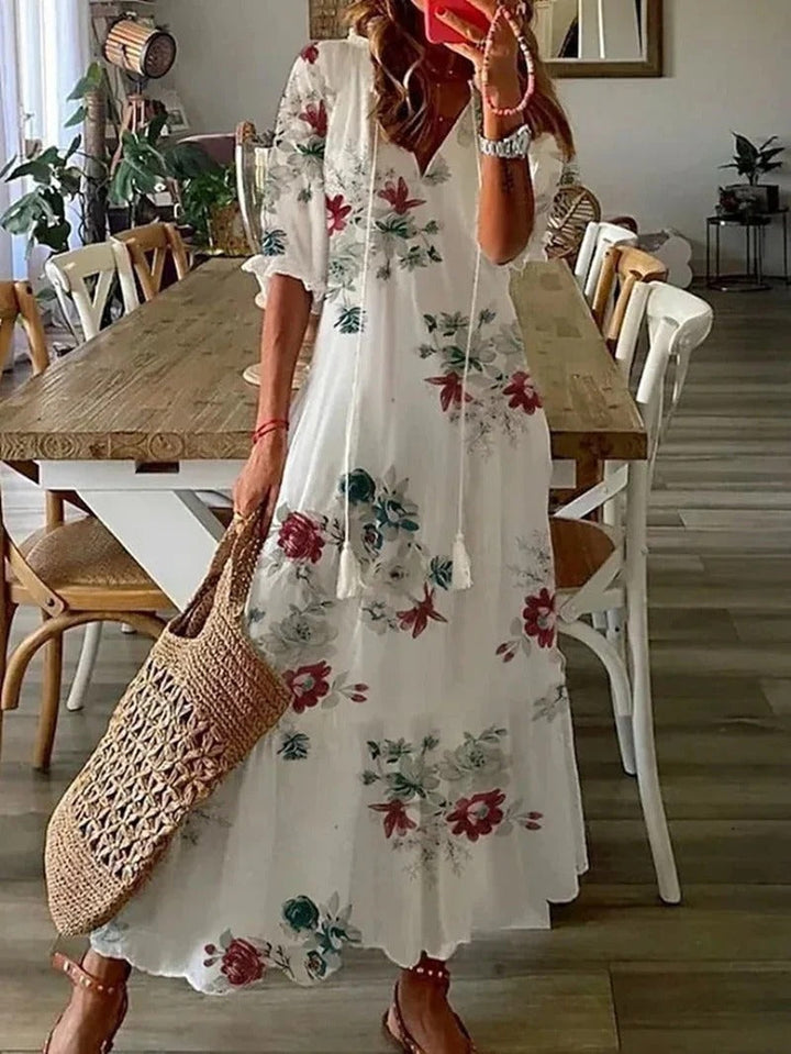 Beautiful flowy women's maxi dress with an eye-catching leaf pattern, ideal for warm weather and elegant wear.