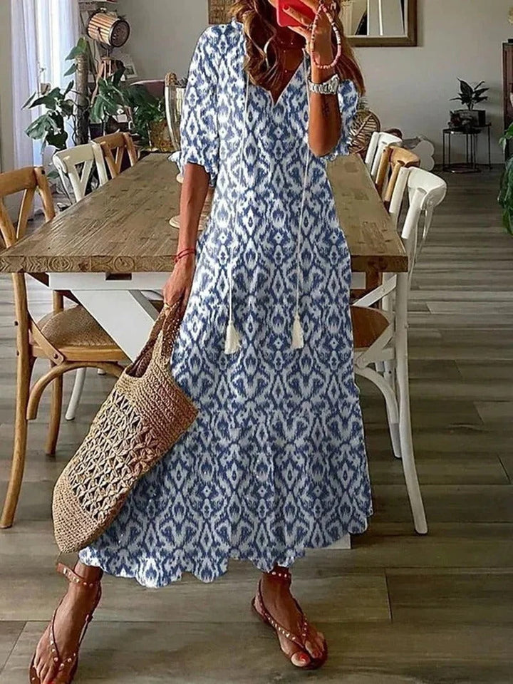 Women's flowy boho maxi dress with elegant leaf pattern, perfect for summer fashion and a-line style.