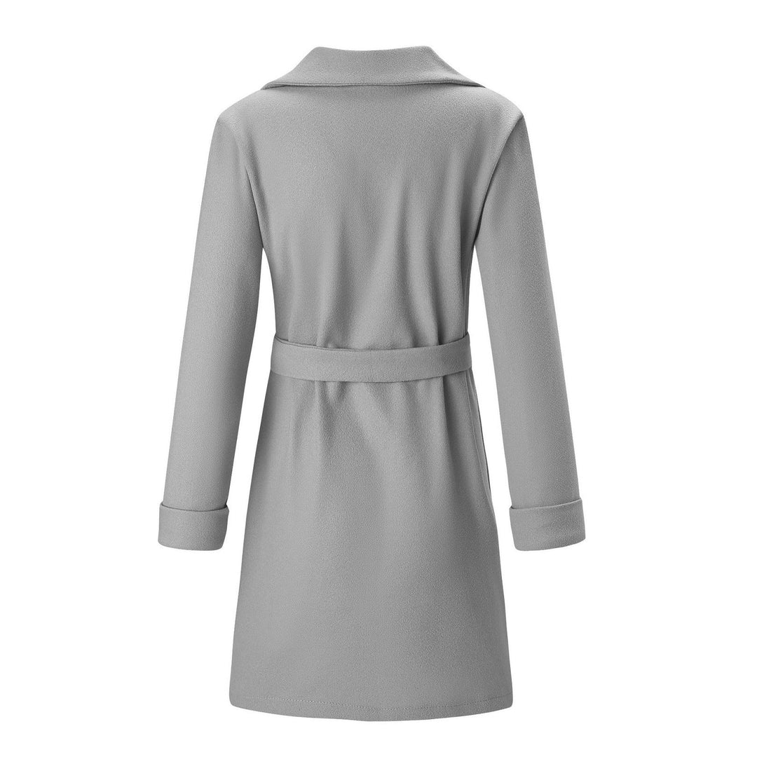 Trendy women's longline double-breasted coat. Cozy wool-look jacket for elegant winter style.