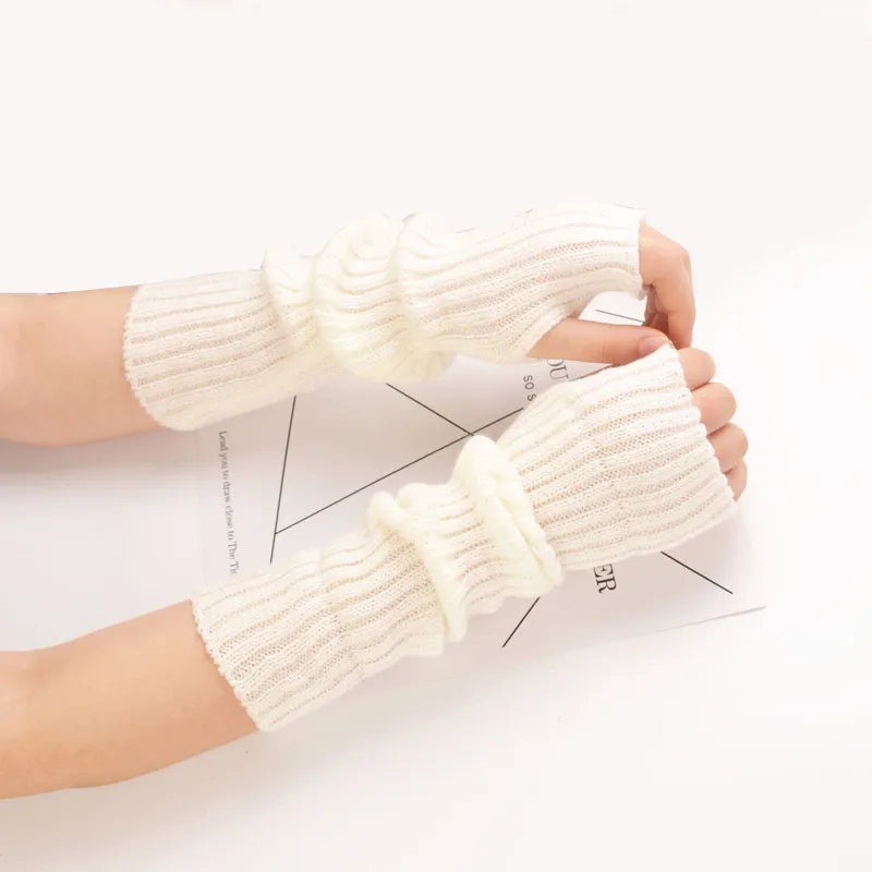 Chic long knitted fingerless gloves for women, providing warmth and flexibility in winter fashion.
