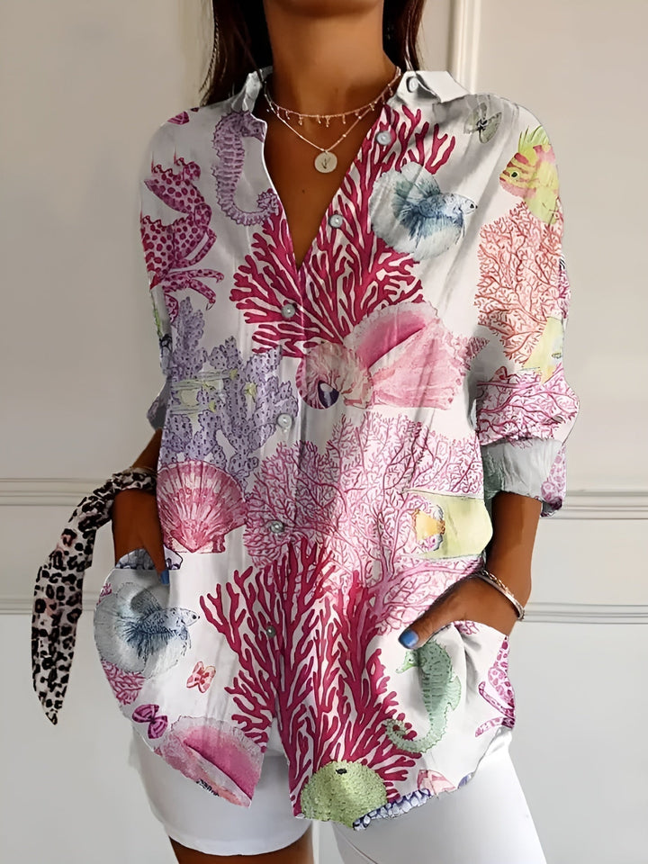 Stylish women's floral print relaxed button-up blouse, an everyday fashion 3/4 sleeve casual shirt.