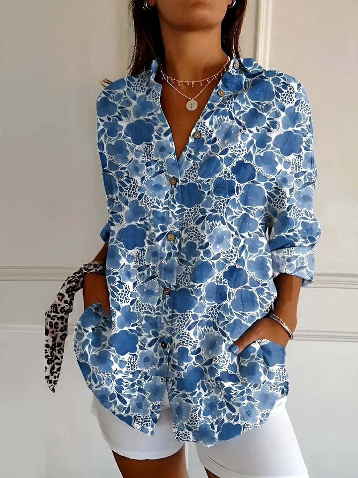 Women's floral print relaxed button-up shirt with 3/4 sleeves, a chic casual summer blouse.
