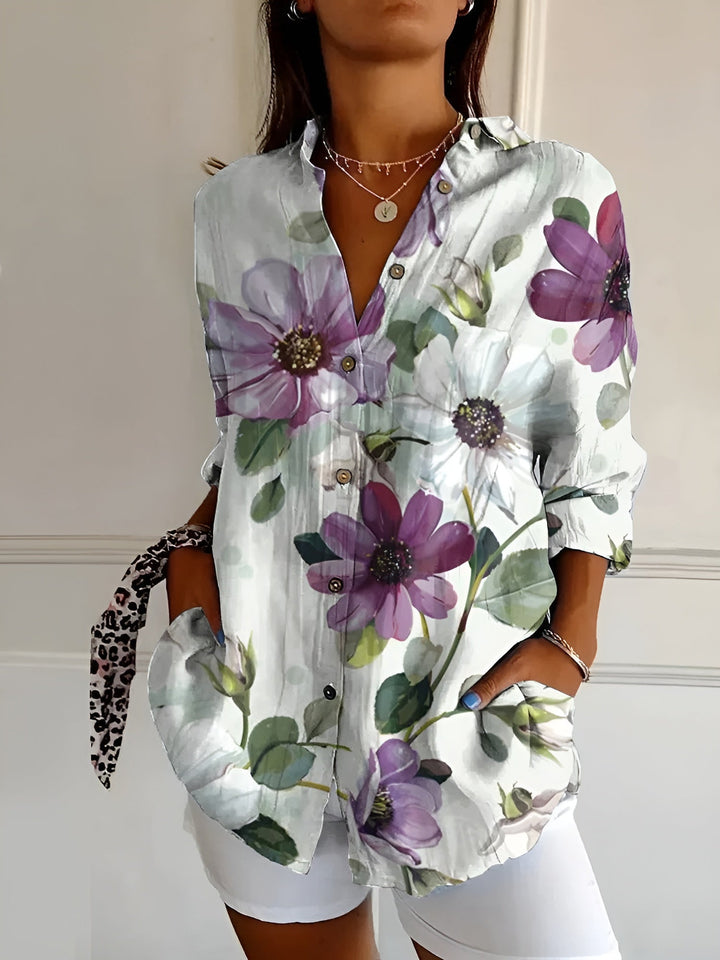 Colorful floral print women's relaxed fit button-up shirt, great for casual summer fashion.