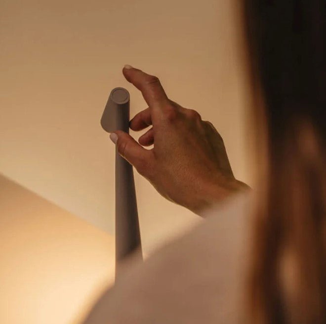 Modern rechargeable table lamp providing dimmable ambient LED mood lighting for any room.