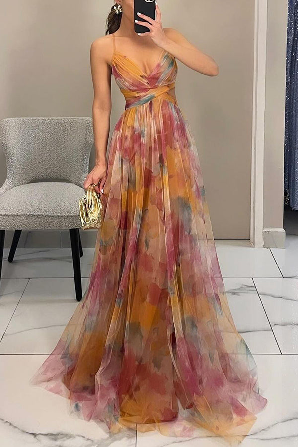 Elegant women's spaghetti strap A-line maxi dress with vibrant watercolor print.