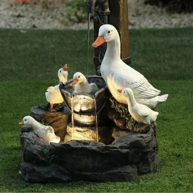 Charming solar-powered duck & squirrel fountain with LED light, an ideal outdoor garden statue water feature.