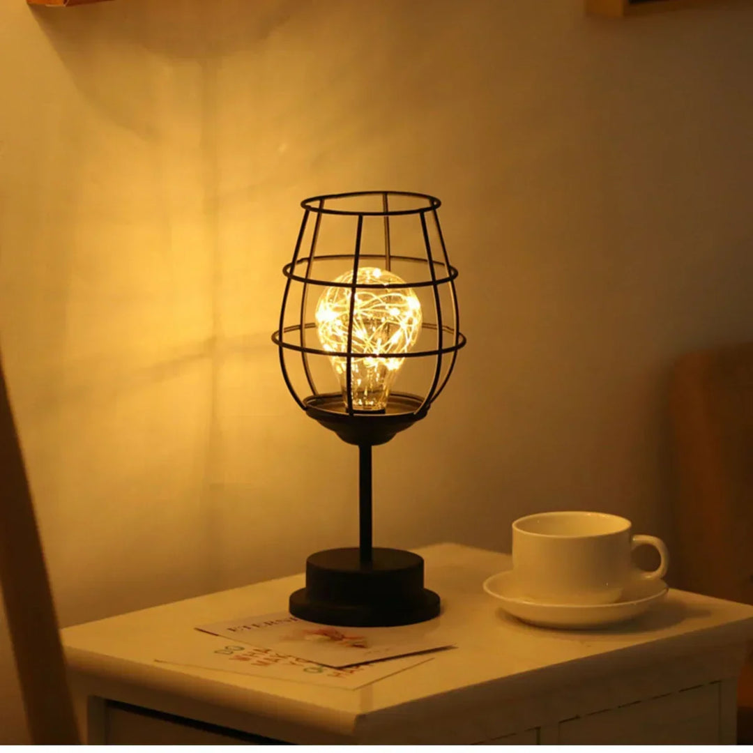 Dimmable adjustable table lamp providing soft accent light, ideal for creating mood lighting in any home decor.