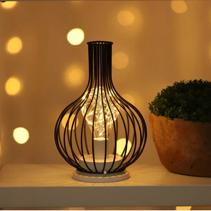 Sophisticated black table lamp with a dark base & fabric shade, ideal for luxurious bedroom or study lighting.