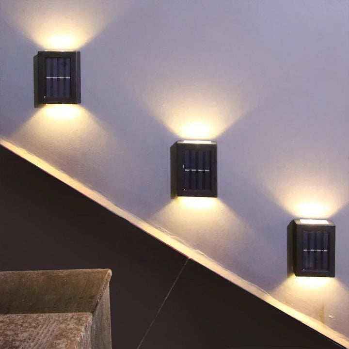 Luxe black solar LED wall mount lamp, ideal for modern patio lighting & garden decor. Wireless & energy-efficient.