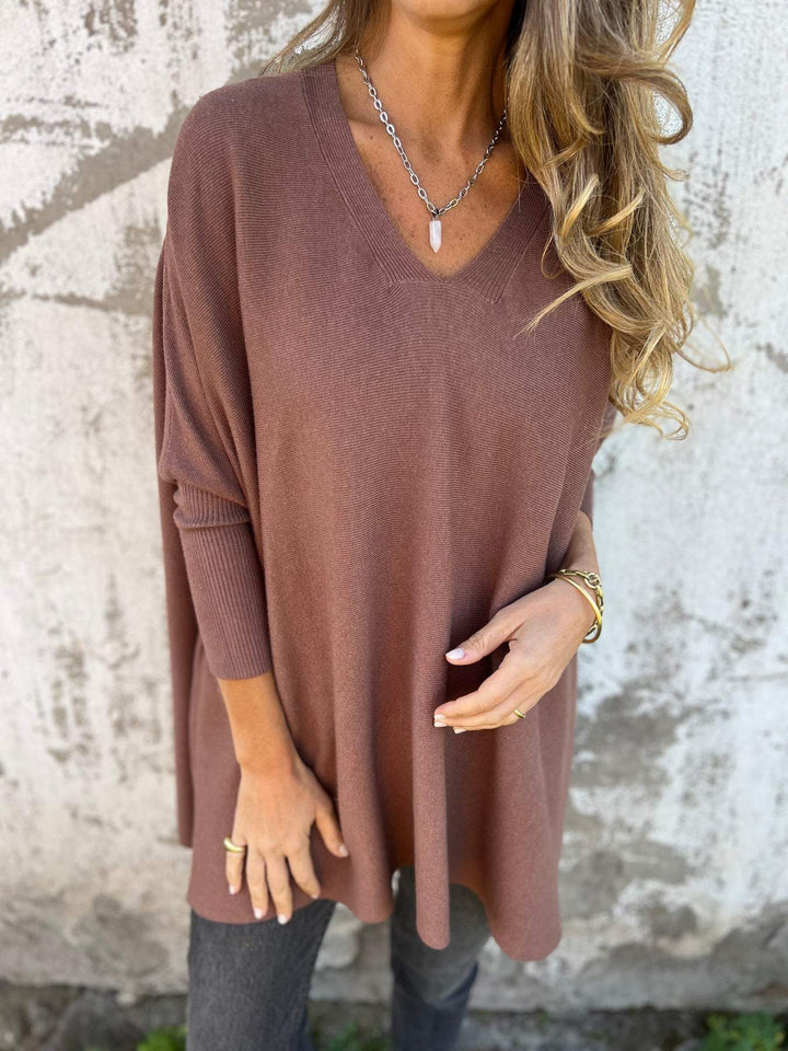 Loose fit knit V-neck pullover, perfect for comfortable women's layering.