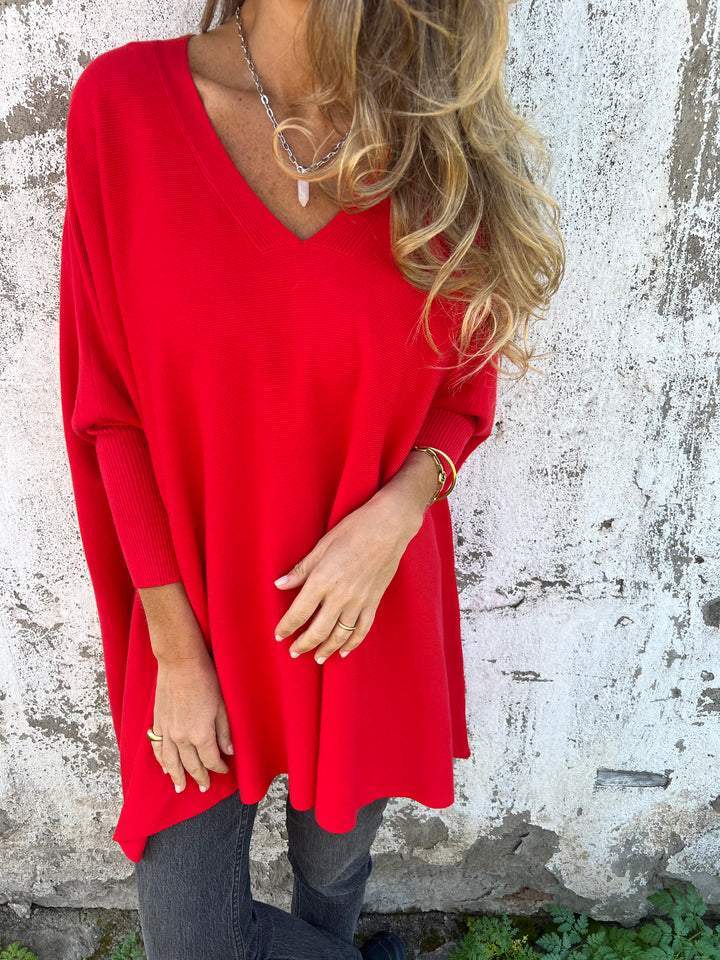 Versatile V-neck long sleeve knit pullover for women, offering effortless oversized style.