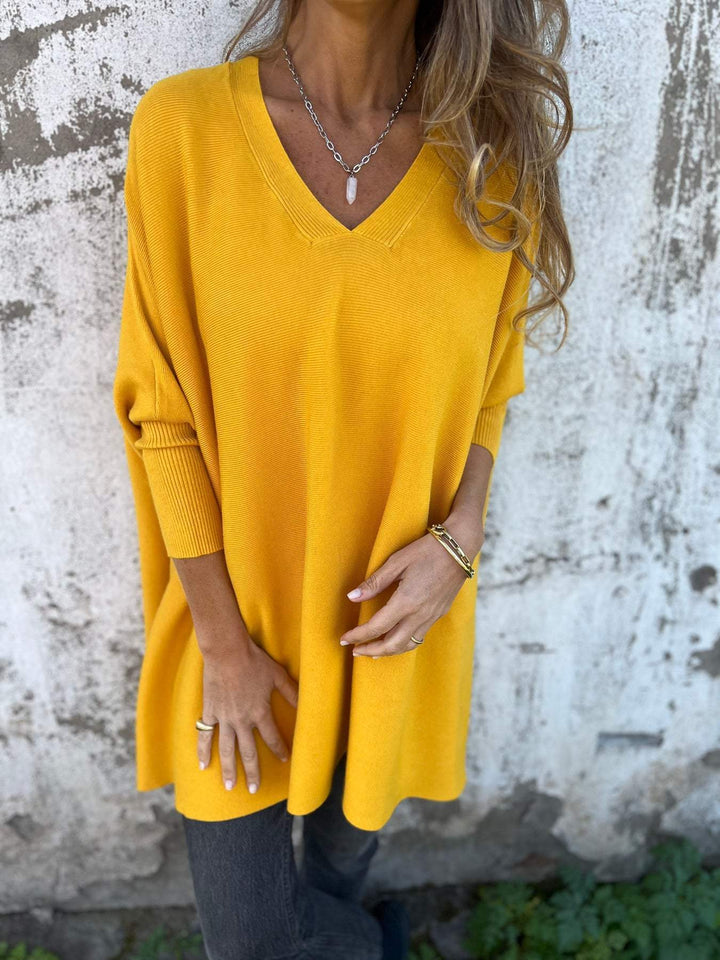 Casual women's oversized V-neck long sleeve knit top, perfect for everyday comfort and style.
