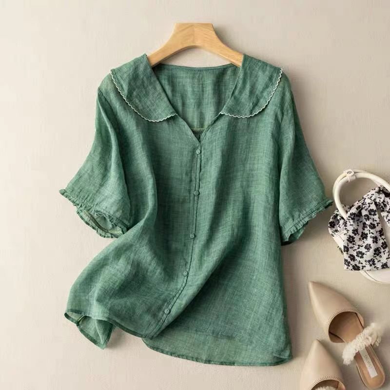 Elegant women's scalloped collar button-up blouse with half sleeves. Versatile top for office or casual spring wear.