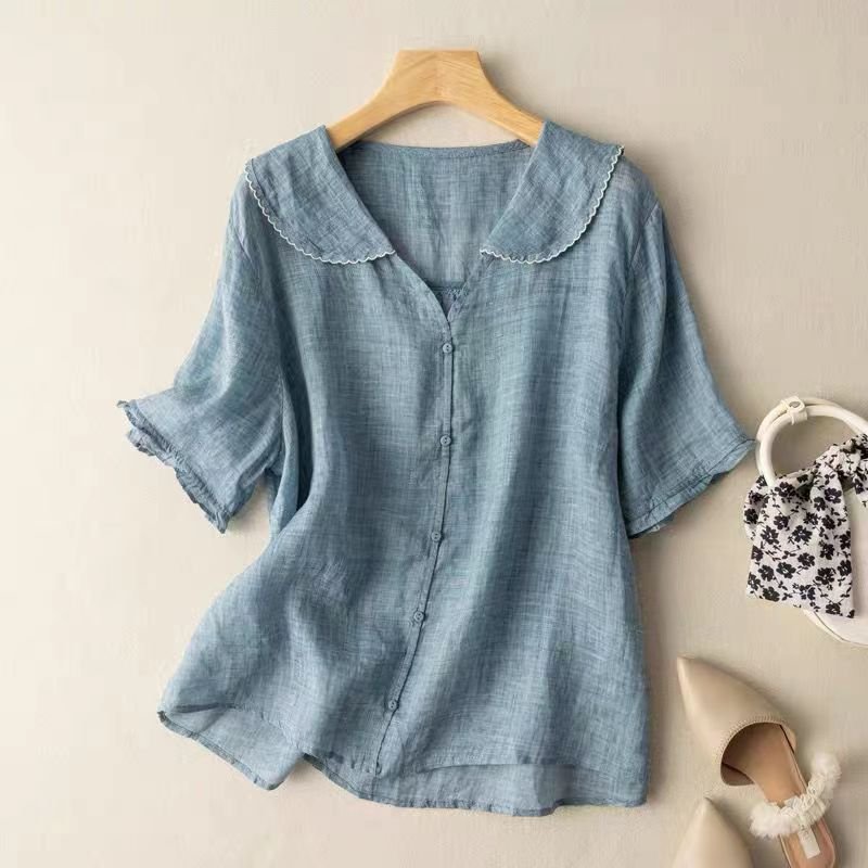Relaxed fit women's button-up blouse with graceful scalloped collar and half sleeves. Elegant versatile top.