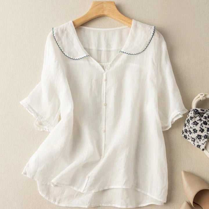 Charming women's half-sleeve blouse featuring a scalloped collar and button-up front. Ideal for spring, summer, office.