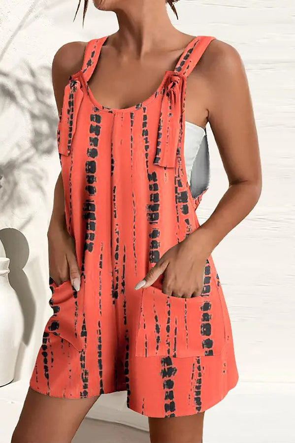 Women's multicolored wide-leg summer jumpsuit with pockets & adjustable straps, perfect for beach or vacation.