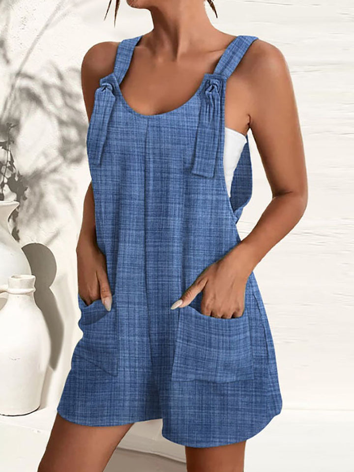 Women's elegant wide-leg summer jumpsuit with adjustable straps, practical pockets & vibrant colors.