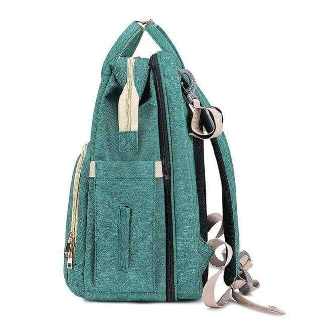 All-in-one baby travel system: a nappy backpack with integrated foldable bassinet and storage.