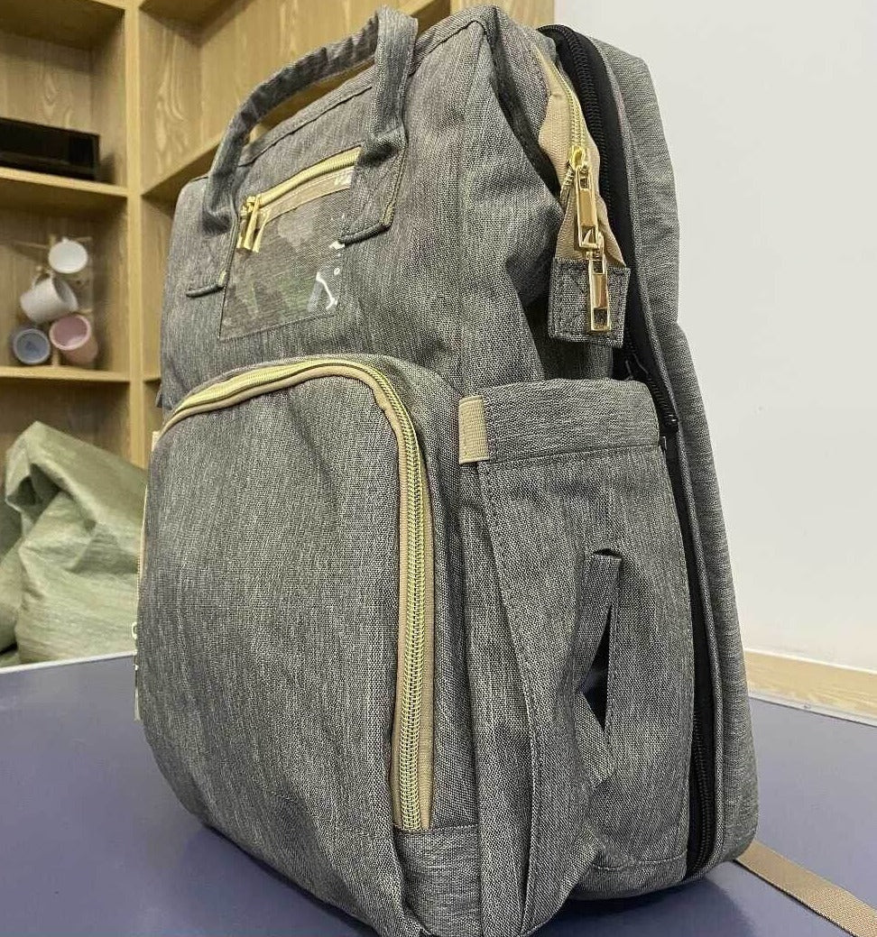 Organizer diaper backpack with foldable bassinet, a practical solution for active parenting.