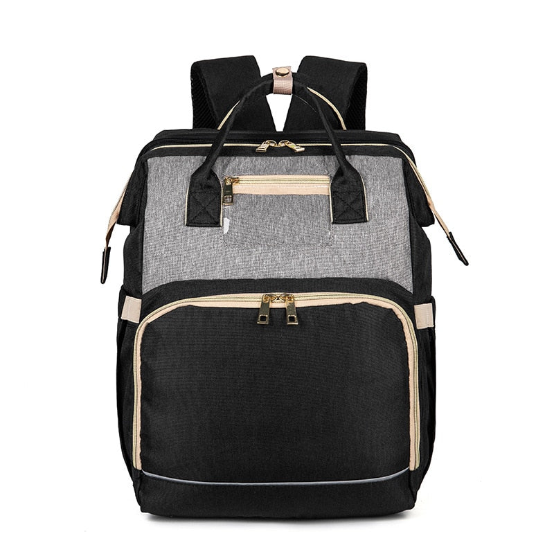 Efficient parenting backpack: nappy organizer with foldable bassinet for easy travel and care.