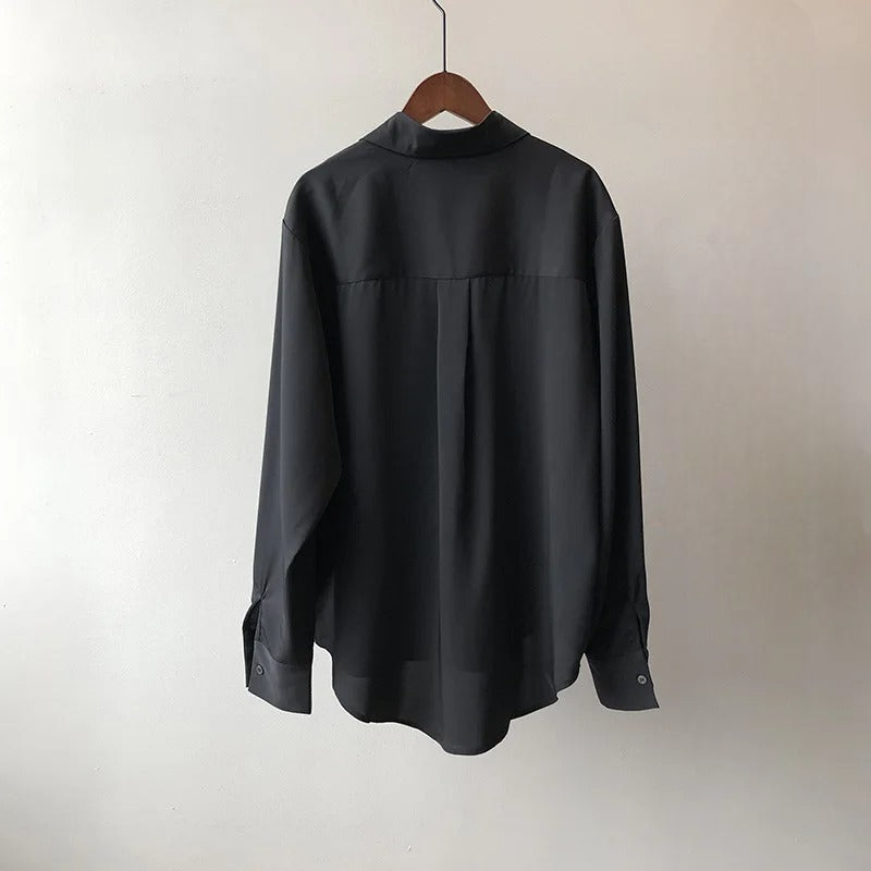 Trendy women's button-up long sleeve blouse. Essential fashion top for versatile everyday and work attire.