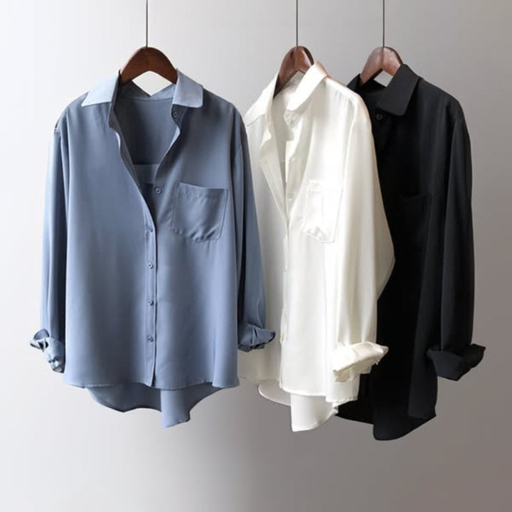 Professional women's long sleeve button-up blouse. Collared shirt for smart office wear or business casual outfits.