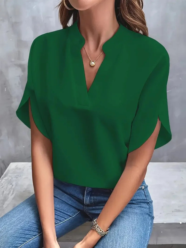 Chic women's V-neck blouse with short sleeves. Elegant & versatile for workwear, spring outfits, or summer fashion.