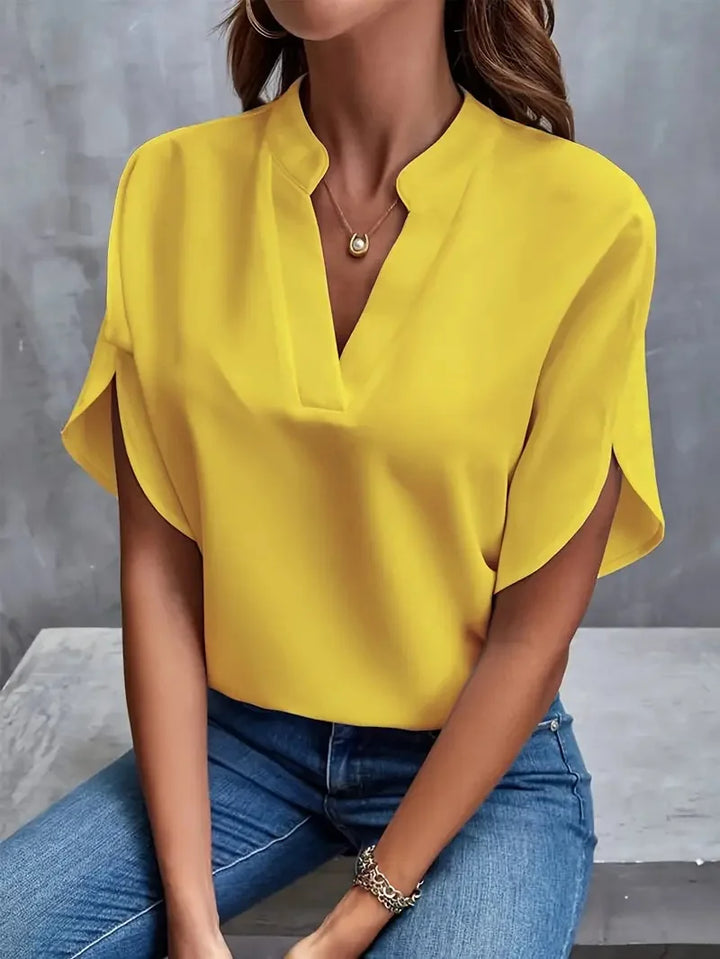 Stylish V-neck top for women, short sleeve. Relaxed comfort, perfect for spring/summer fashion & casual elegant outfits.