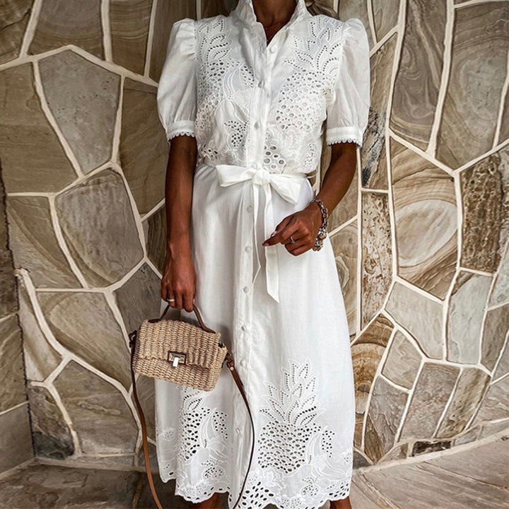 Stylish women's flowing embroidered maxi dress, a chic vacation outfit or elegant summer dress.